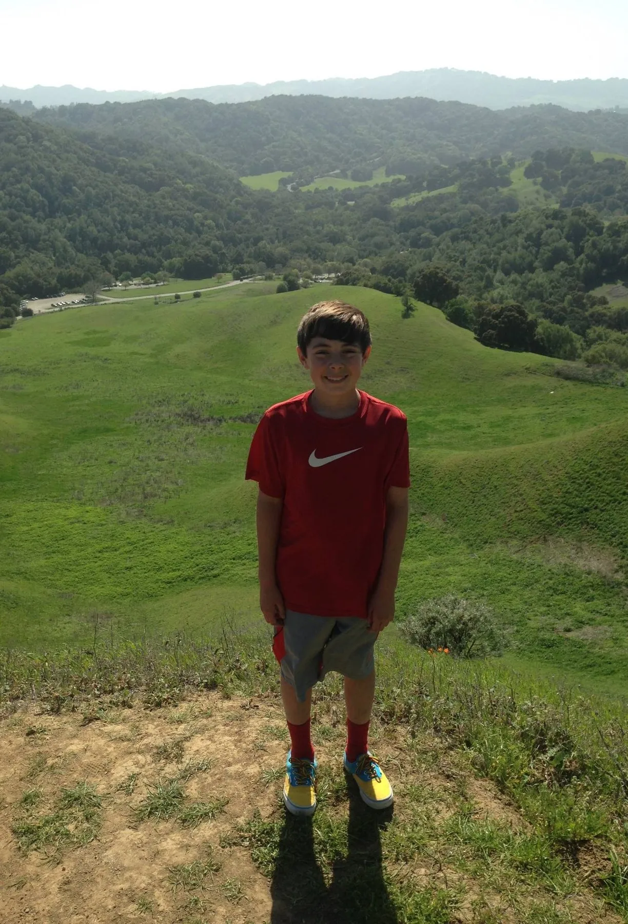 Luke as a kid on a green Bay Area hilltop